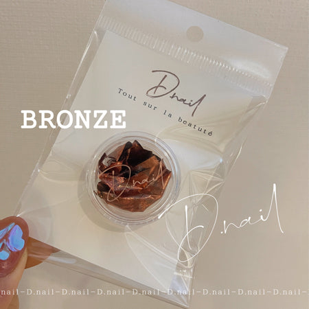 D. NAIL foil flakes bronze